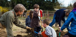 Common Threads Farm students work in the garden.