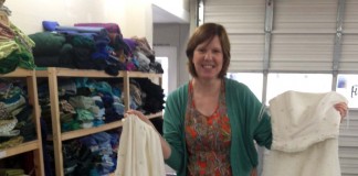 Woman poses with wedding dresses for Ragfinery's second Upcycle Challenge.