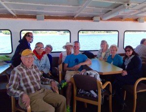 Volunteer Denis Hayner (far left) enjoys a ride to the islands on San Juan Cruises.