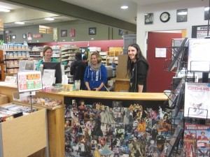 (From left) Volunteer Coordinator, Anna Larson, Manager, Dee Dee Chapman, and employee, Benjamin Owens, work hard to settle in at their new location in the Bellingham Public Market.