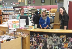 (From left) Volunteer Coordinator, Anna Larson, Manager, Dee Dee Chapman, and employee, Benjamin Owens, work hard to settle in at their new location in the Bellingham Public Market.
