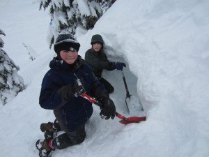 Bellingham friends Asa Row and Max Duryee take a break from sledding at Mount Baker to dig their snow cave.