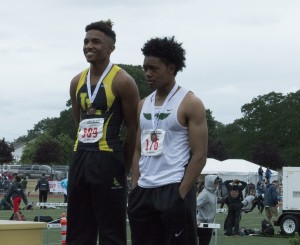 Lynden's Christian Payne stands on the podium after receiving his fifth-place medal in the boys' 2A 100.