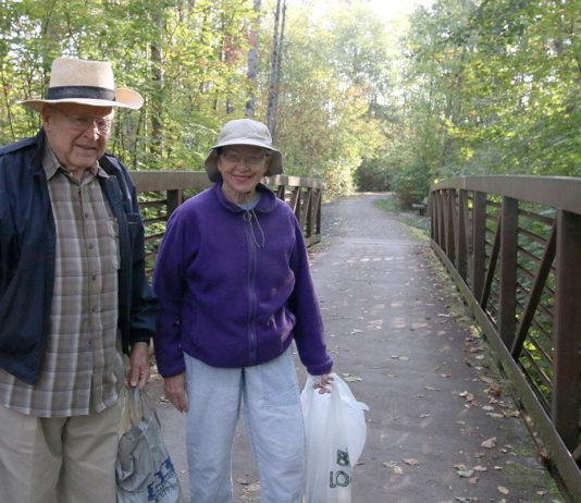 couple picking up trash