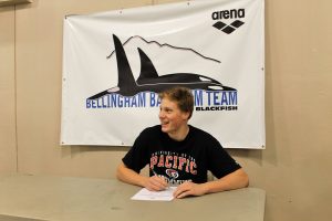 Rowan King signed his letter of intent to swim for the University of the Pacific in Stockton, California. Photo credit: Christina Boyd of the Bellingham Bay Swim Team.