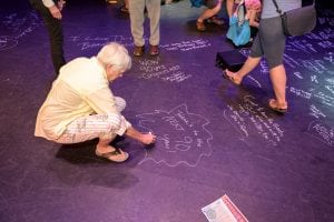 Mount Baker Theatre patrons became a part of history by signing the stage at the MBT summer event. Photo courtesy: Mount Baker Theatre.