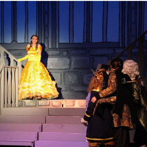 Bell descends the stairs to meet Beast in this classic play. Photo courtesy: Squalicum High School Theater.