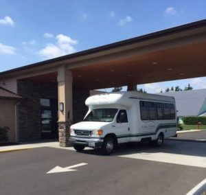 As the bus pulls up, members of the Northwest Adult Day Health and Wellness Center are met with care and compassion. Photo courtesy: Northwest Adult Day Health and Wellness Center.