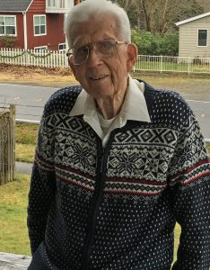 Gordon Tweit sits on the front porch where he captured a bolt of lightning, with his Kodak camera, when he was just ten years old. Photo credit: Dondi Tondro-Smith.