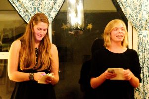 Two members of The Poem Store, Natalie Fedak (L) and Erica Reed compose poetry on the spot at poetrynight. Photo credit: Gary Wade.