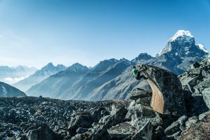 Gabe Rogel captured Peter Doucette hanging off this rock at Ama Dablam base camp in Khumbu, Nepal. Photo credit: Rogel Media. 