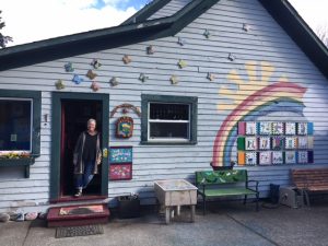 Pam Sinnett hovers in the doorway of one of the school house classrooms at Samish School. Photo credit: Dondi Tondro-Smith.