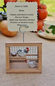 Based off of the original chicken coop ornament, Tracy now creates photo holder coops that can sport a farm-to-table menu or an event place card. Photo courtesy: A Piece of the Farm.