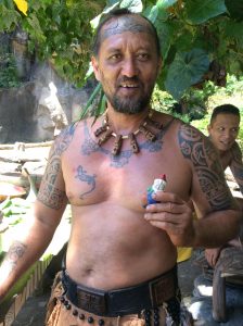 A village chief on the island of Oa Pua in the Marquesas holding Virginia's granddaughter's gnome. Photo courtesy: Virginia Malmquist.