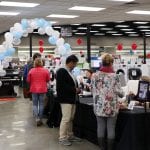 People buying raffle tickets to benefit Lighthouse Mission