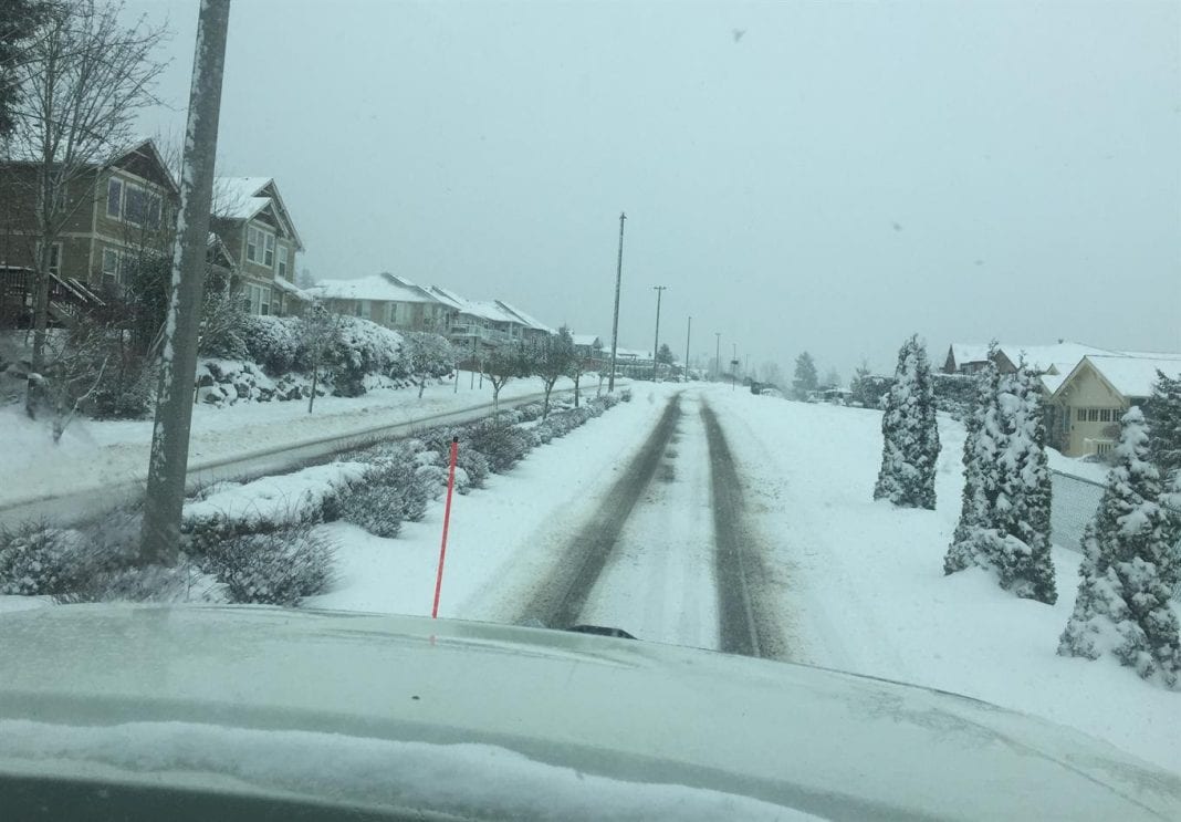 Working to clear Chandler Parkway of snow on Tuesday morning in the City of Bellingham.