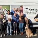 WWU Communications Class pose with van and animals (1)