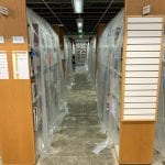 Library-Remodel-Book-Stack-covered-in-plastic-Vertical