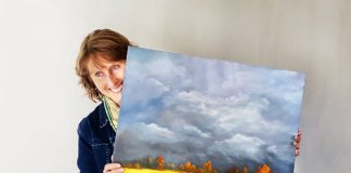 woman holding painting