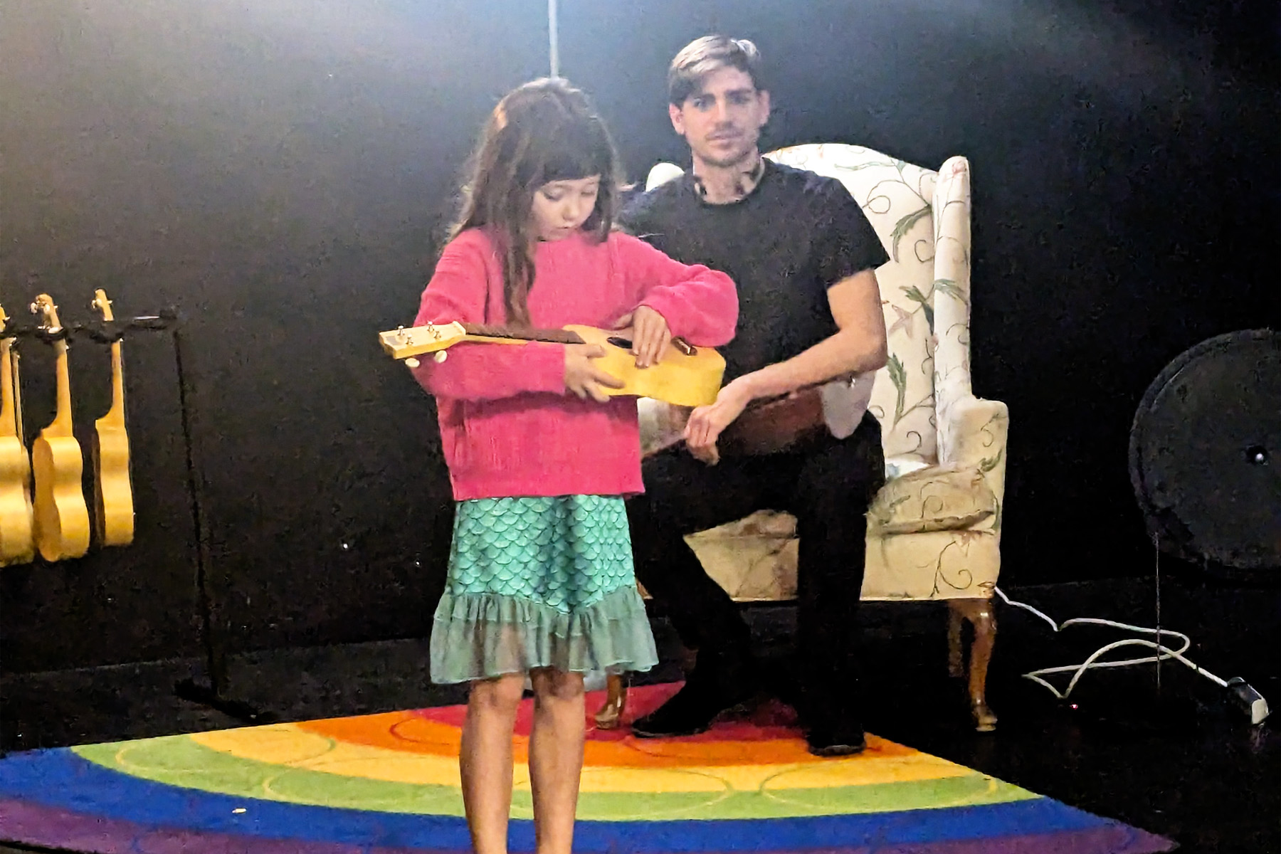 Tyler Becker Looks On As Eilis Plays Ukelele